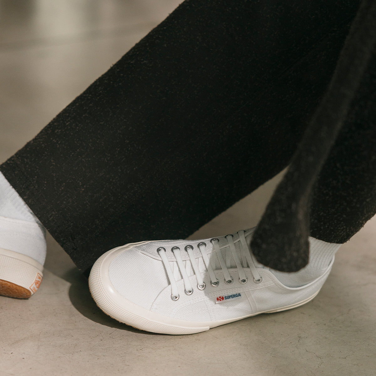superga white sneakers with white laces worn with white socks