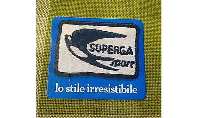 The Superga Swallowtail logo.