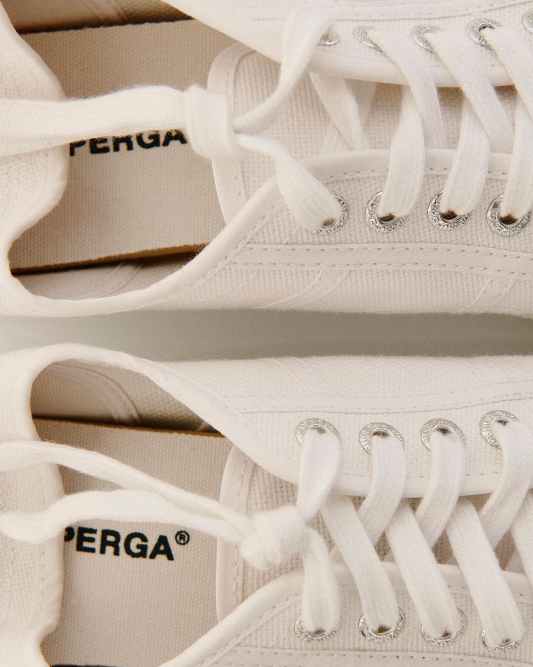 A close up image of White Superga 2750 Cotu Classic Sneakers.